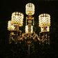 Gold pearl beaded candelabra centerpiece with crystal pendants.