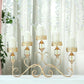 Antique gold metal 5 arm pillar candle candelabra with hurricane glass holders.