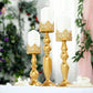 Antique gold lace hurricane candle holders set of 3 with white candles.