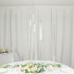 Clear 5-arm crystal candelabra with round mirror base on a table setting.