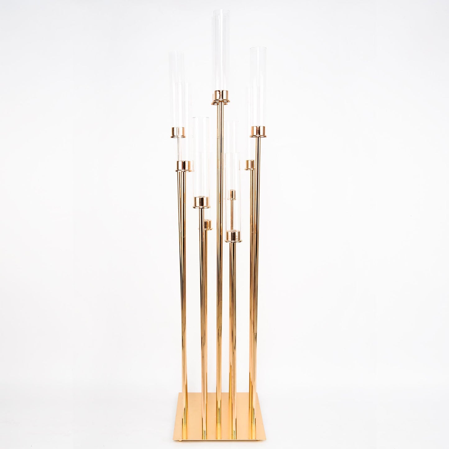 Gold 10 arm taper candle holder with clear glass shades.