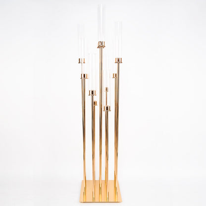 Gold 10 arm taper candle holder with clear glass shades.