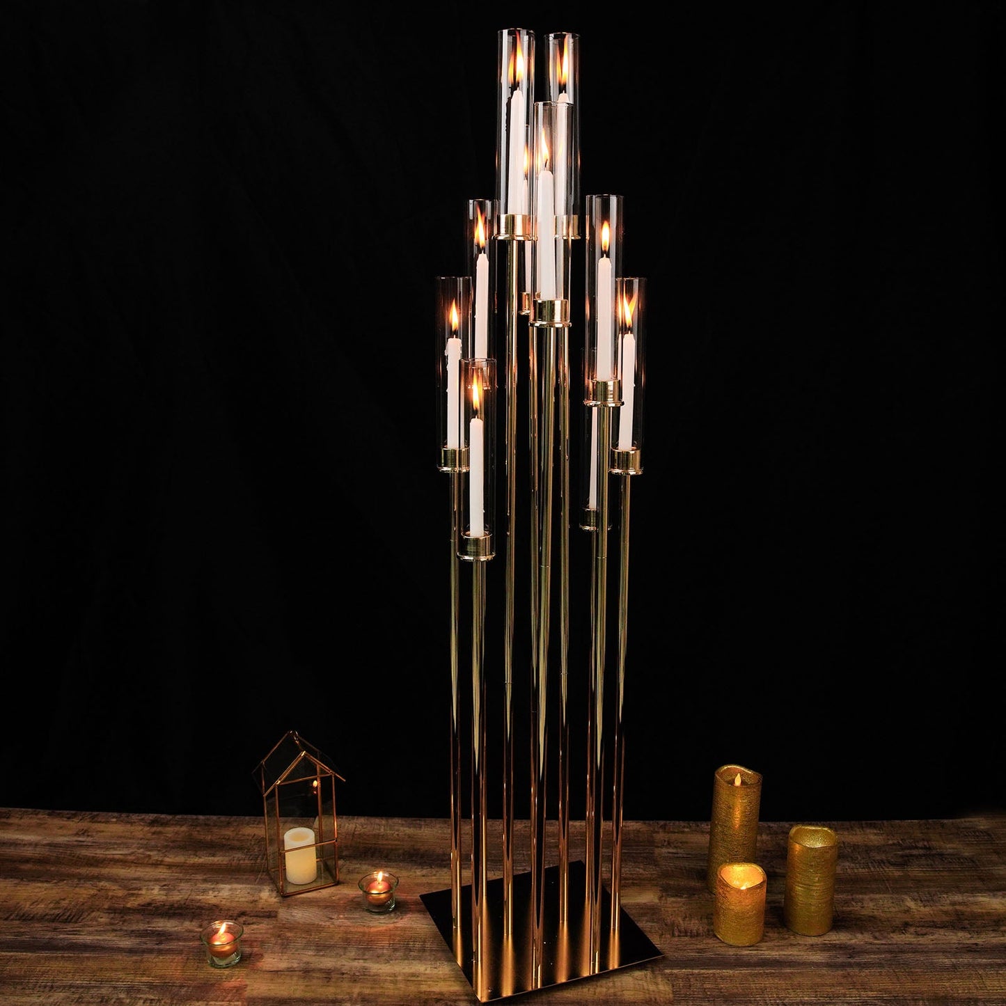 Gold 10 arm taper candle holder with clear glass shades, large arrangement.