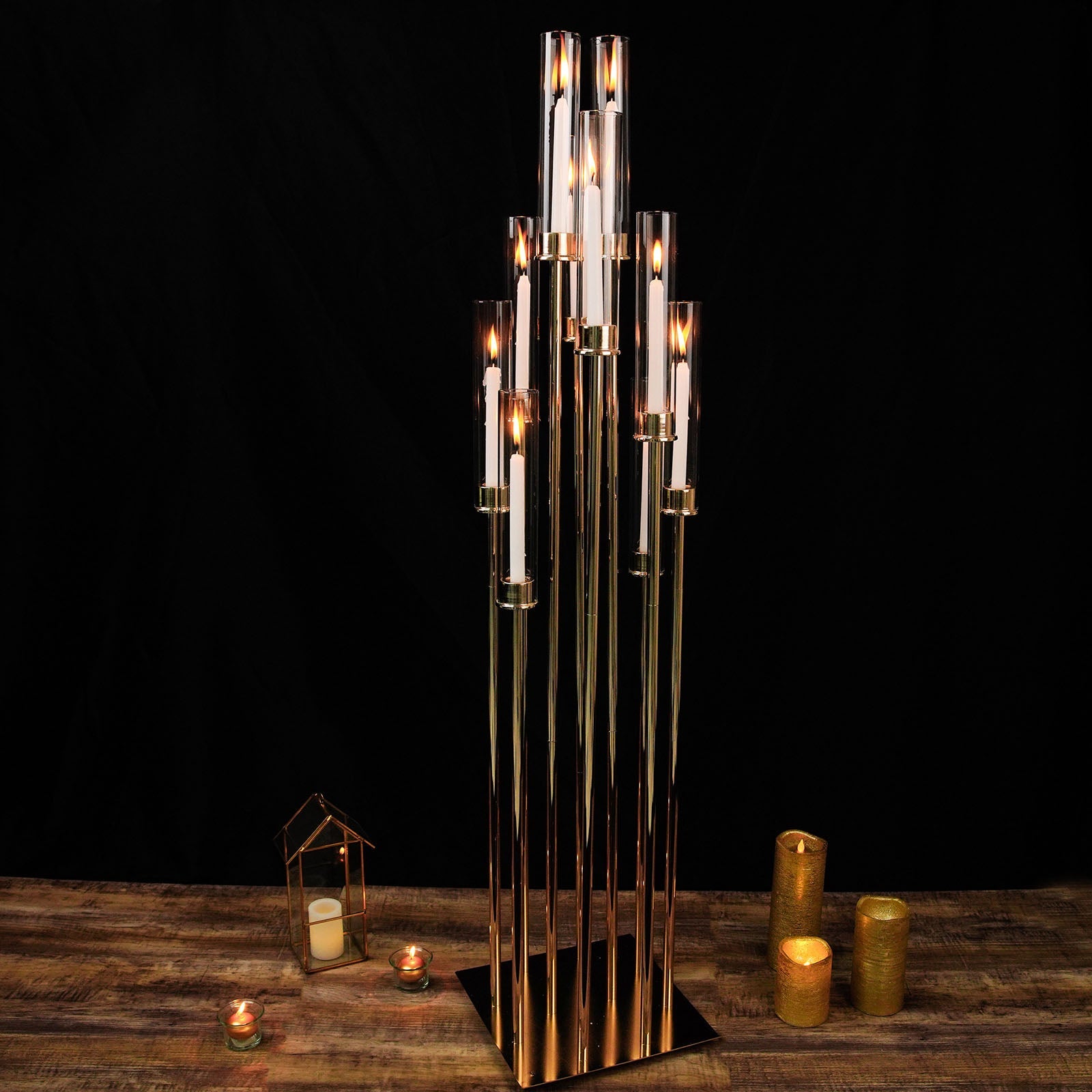 Gold 10 arm taper candle holder with clear glass shades, large arrangement.