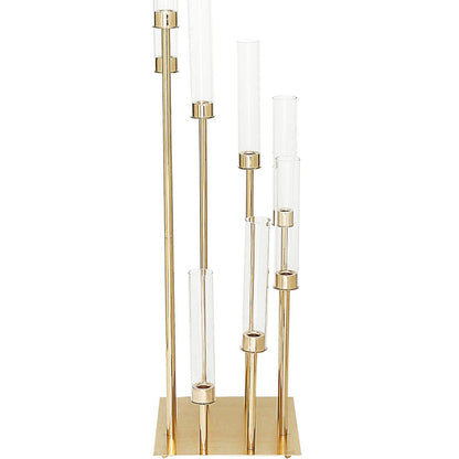 Gold 8 arm candle holder with clear glass shades in large arrangement.