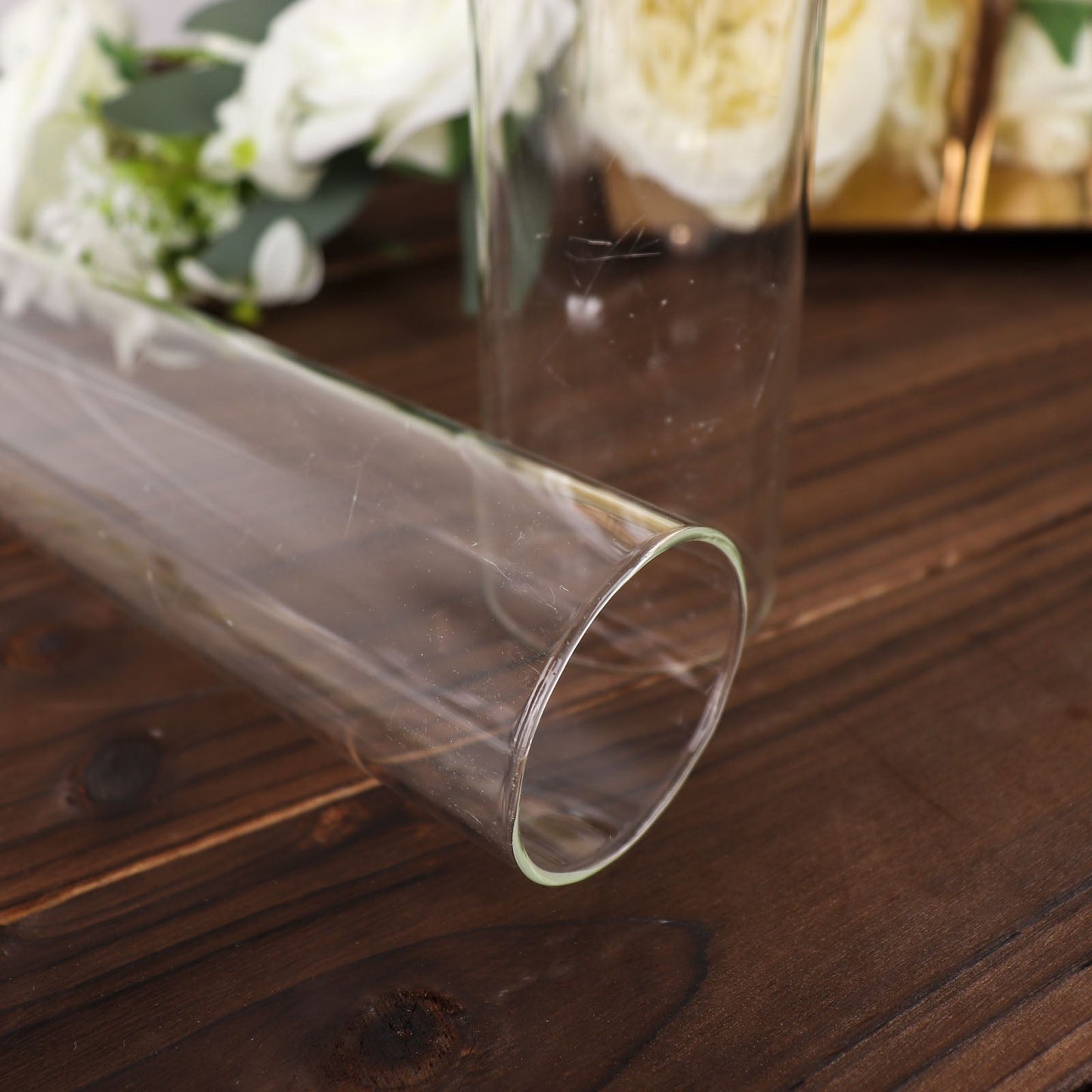 Clear glass candelabra candle holder with open end hurricane shade.