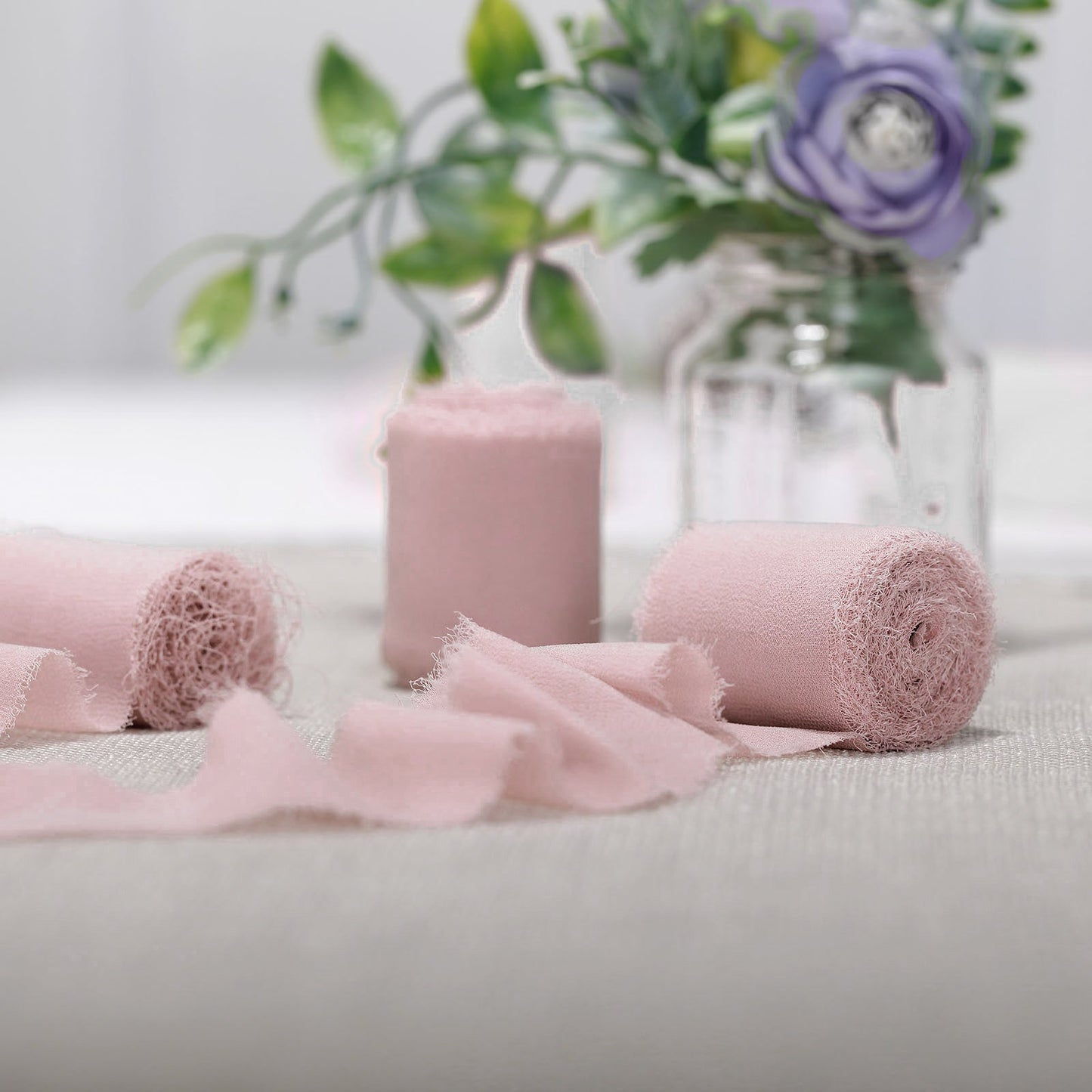Blush chiffon ribbon rolls for bouquets and gift wrapping.