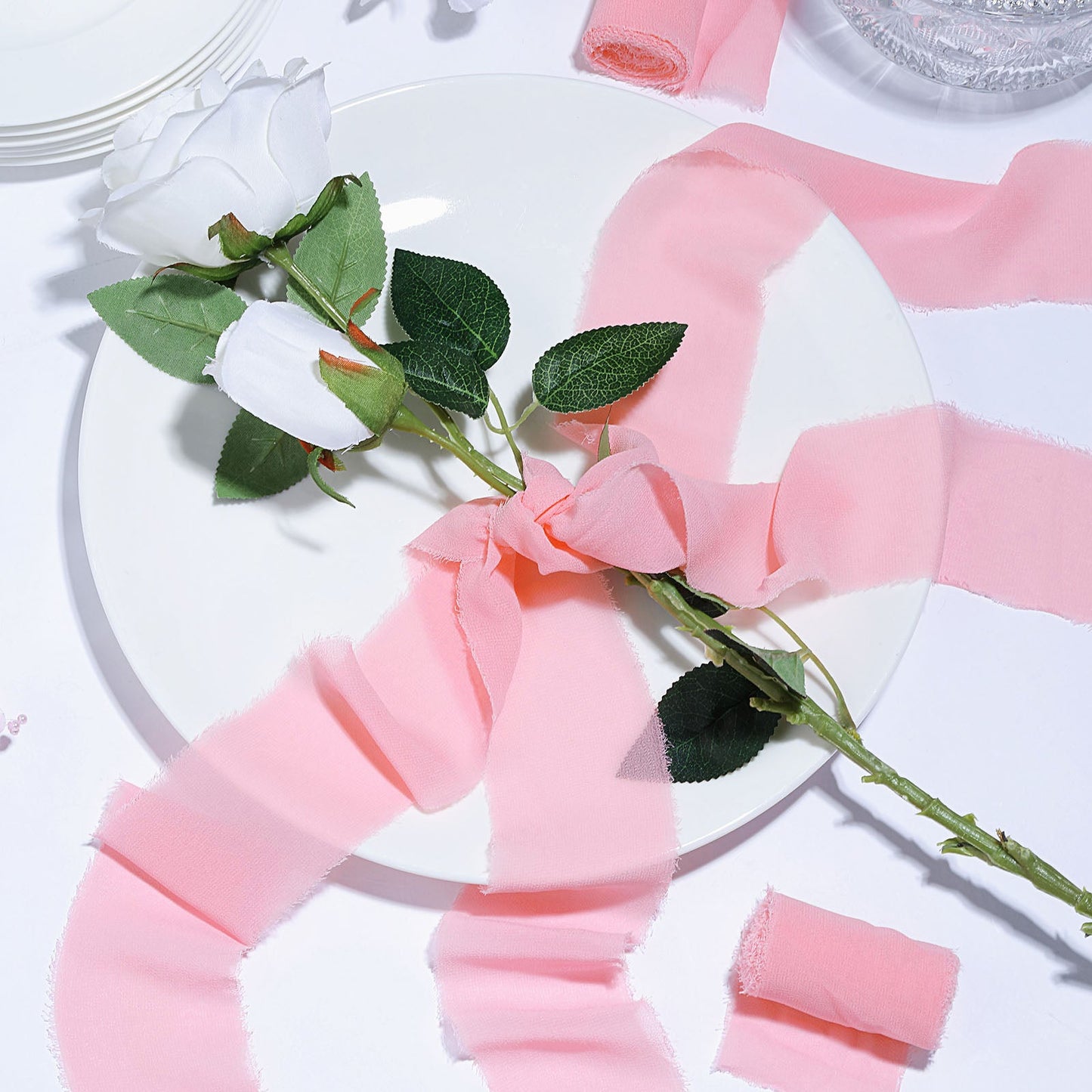 Pink chiffon ribbon roll for bouquets and gift wrapping.