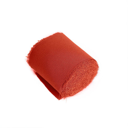 Terracotta silk-like chiffon ribbon roll for DIY projects.