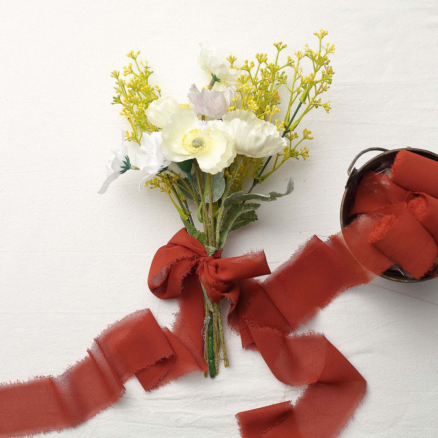 Terracotta silk-like chiffon ribbon roll with DIY wedding bouquet.