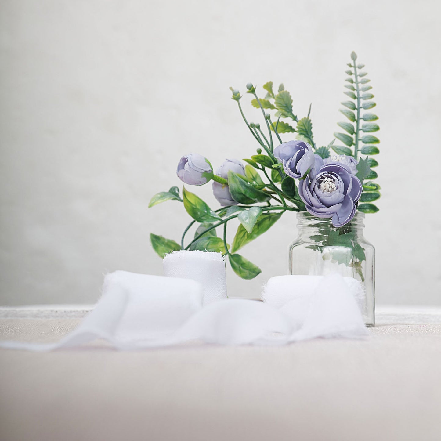 White chiffon ribbon roll for bouquets and gift wrapping.