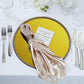 Gold metallic charger plate with rhinestone rim on a table setting.