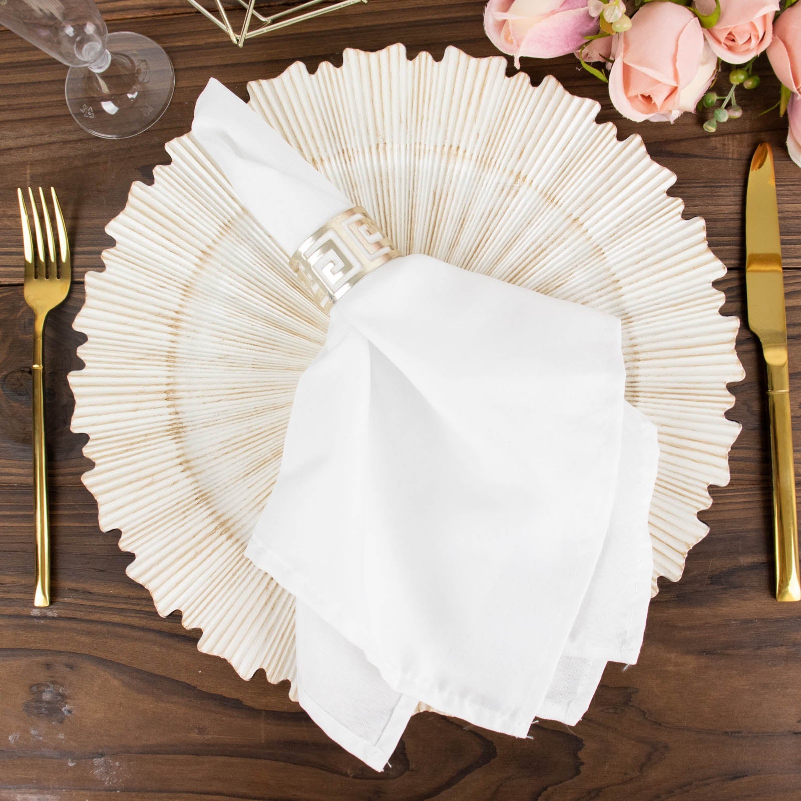 Antique white round charger plate with sunray scalloped rim.