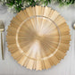Metallic gold sunray acrylic serving plate with scalloped rim.