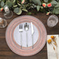 Rose gold rustic lace embossed acrylic charger plate with utensils on a table setting.