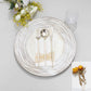 White washed round disposable charger plate with embossed design.