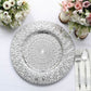 Silver embossed peacock design disposable charger plate on a table setting.