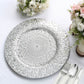 Silver embossed peacock design disposable charger plate on a white tablecloth.