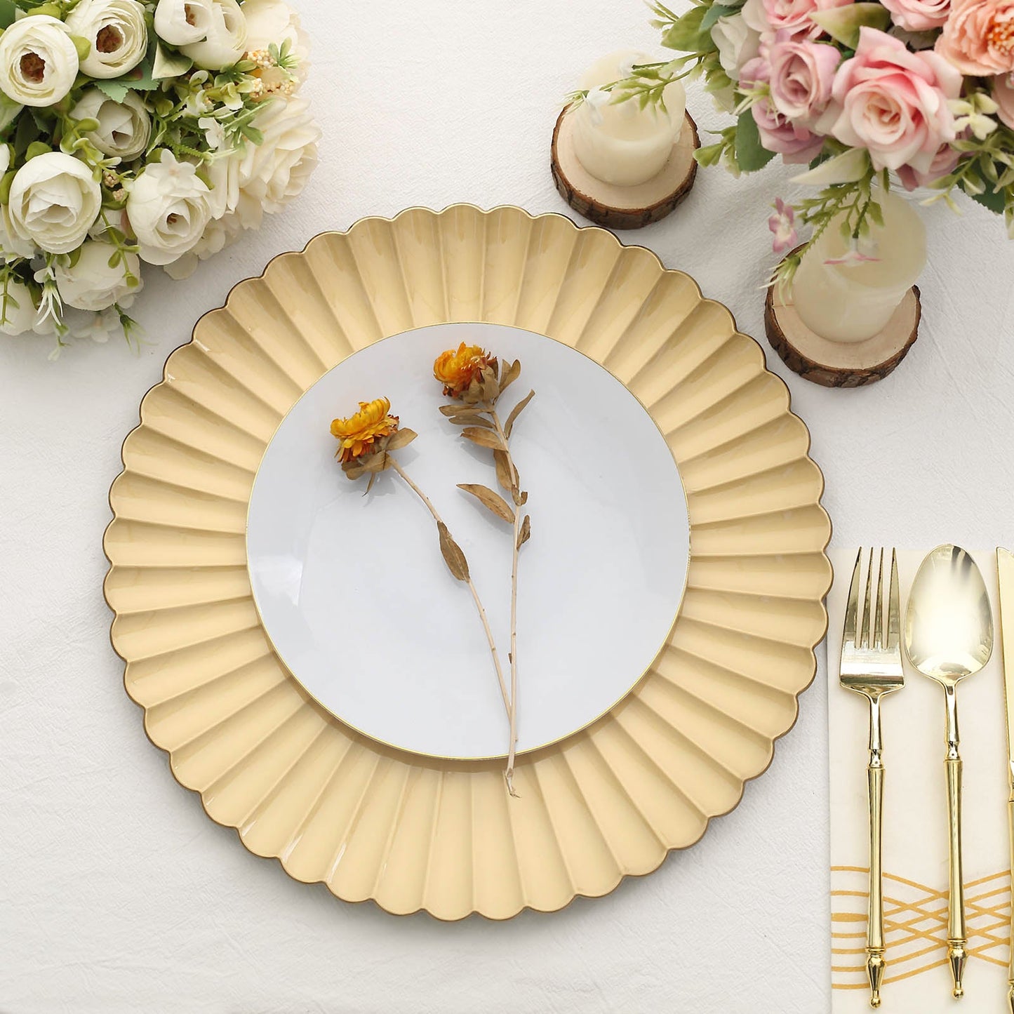 Gold scalloped shell pattern plastic charger plate on a table setting.