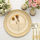 Gold scalloped shell pattern plastic charger plate on a table setting.