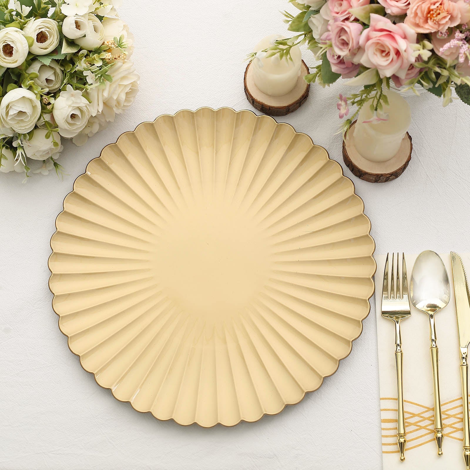 Gold scalloped shell pattern plastic charger plate on a table setting.