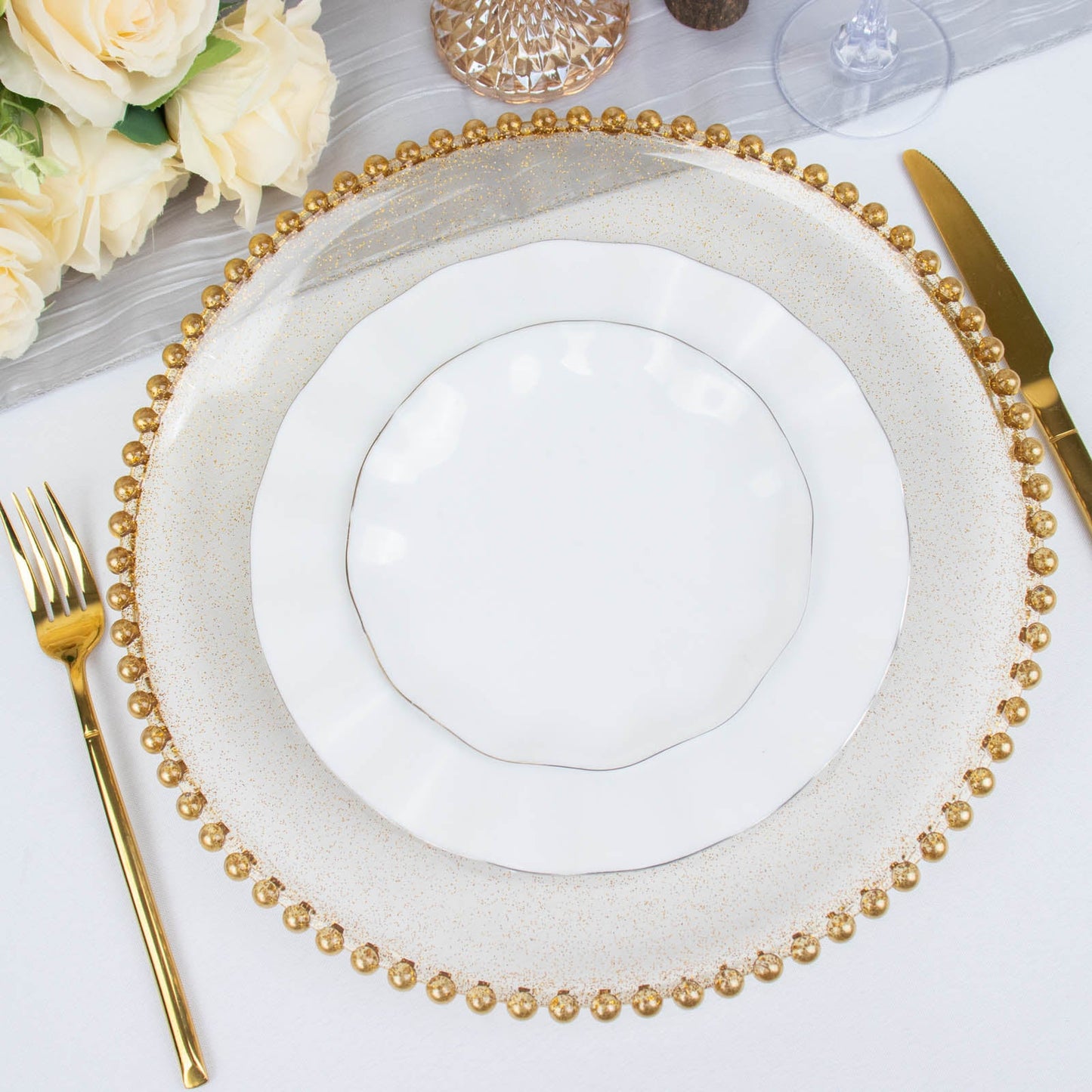 Clear gold glitter acrylic charger plate with beaded rim.