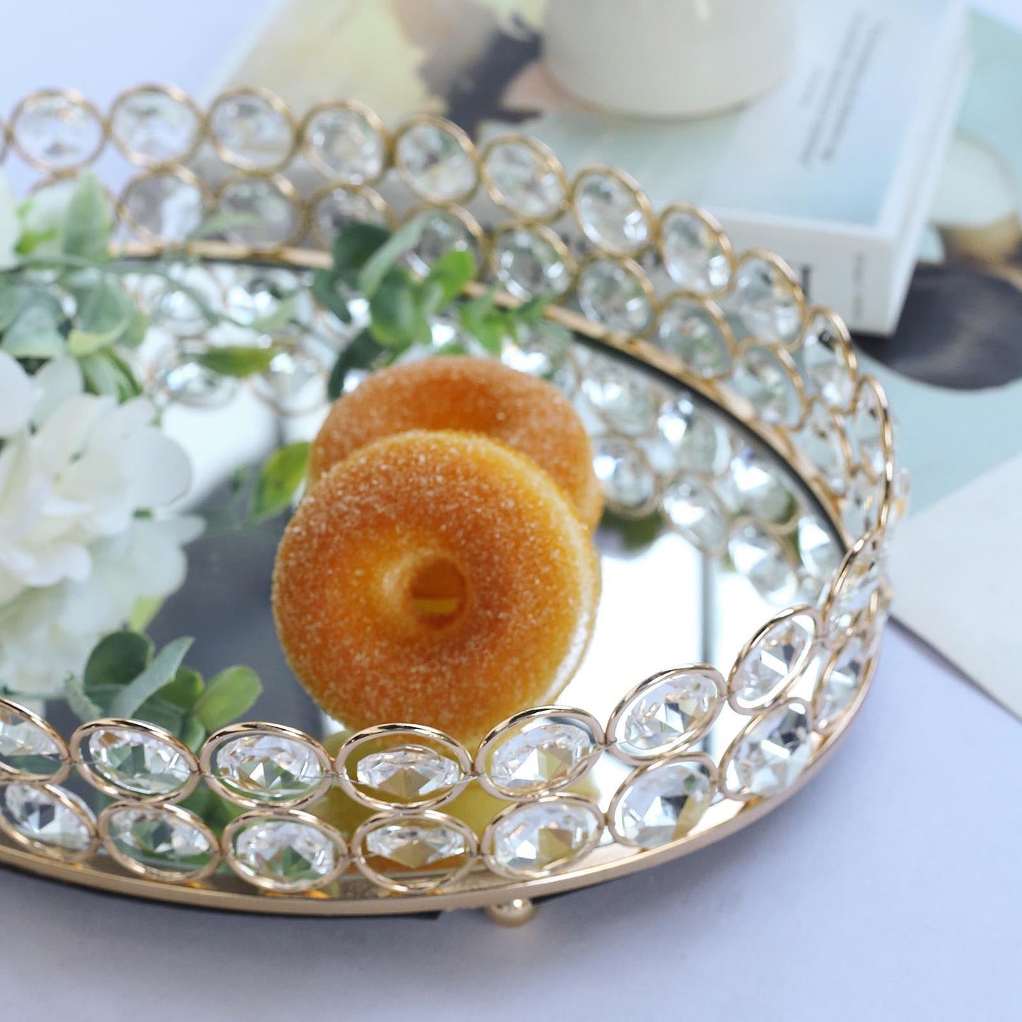 Gold crystal beaded oval vanity tray with mirror surface and decorative elements.