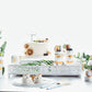 White decorative vanity serving tray with mirrored surface and handles.