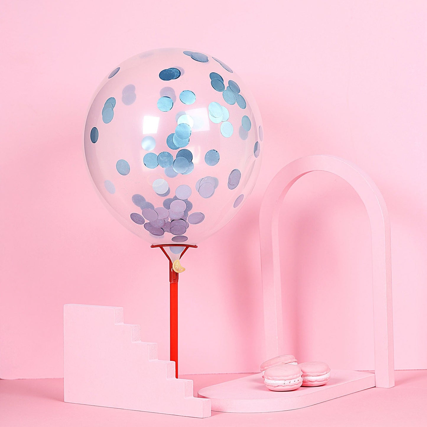 Dusty blue round foil metallic table confetti dots and balloon decor.
