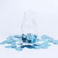 Dusty blue round foil metallic table confetti dots in a glass jar.