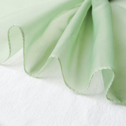 Sage green chiffon curtain panel with a soft, flowing drape.