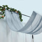 Dusty blue chiffon curtain panel draped with floral accents.