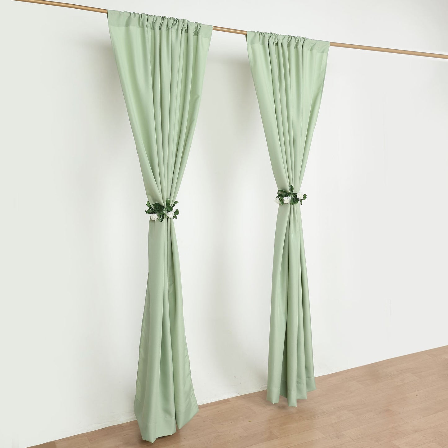 Sage green polyester backdrop drape curtains with rod pockets.