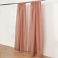 Terracotta drape curtains on a rod, perfect for events and dividers.