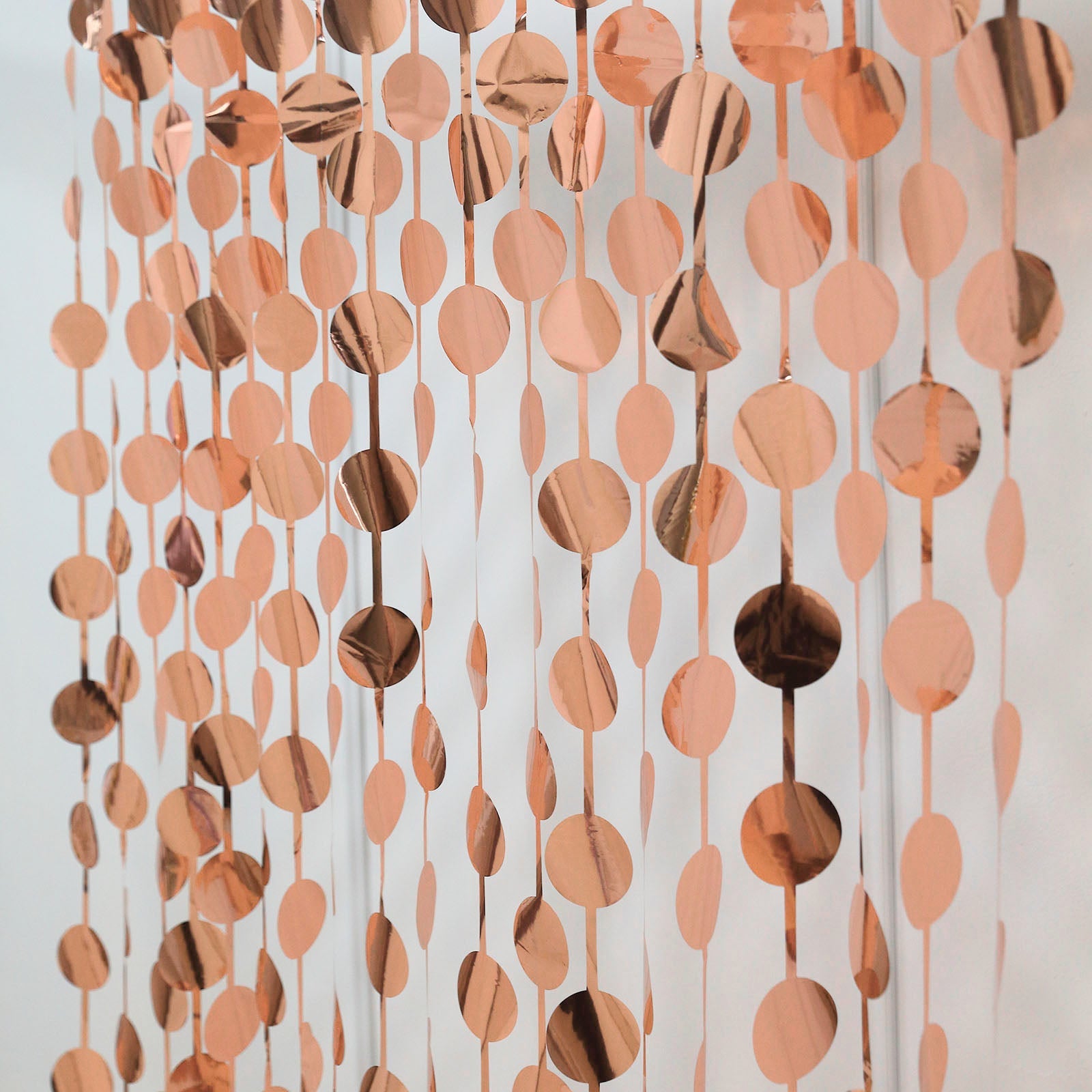 Rose gold foil fringe curtain backdrop for parties and events.