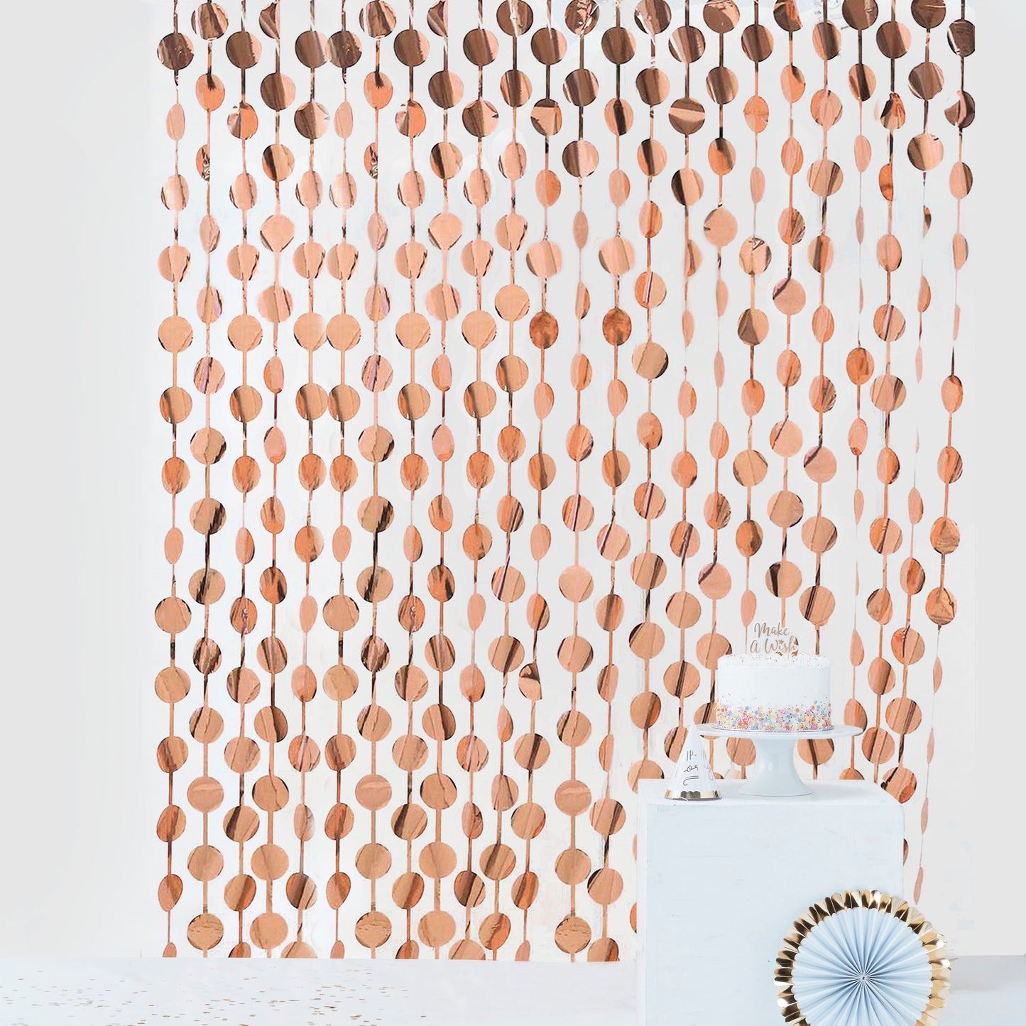 Rose gold foil fringe curtain backdrop for party decor.