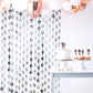 Metallic silver foil fringe curtain backdrop for party decor.