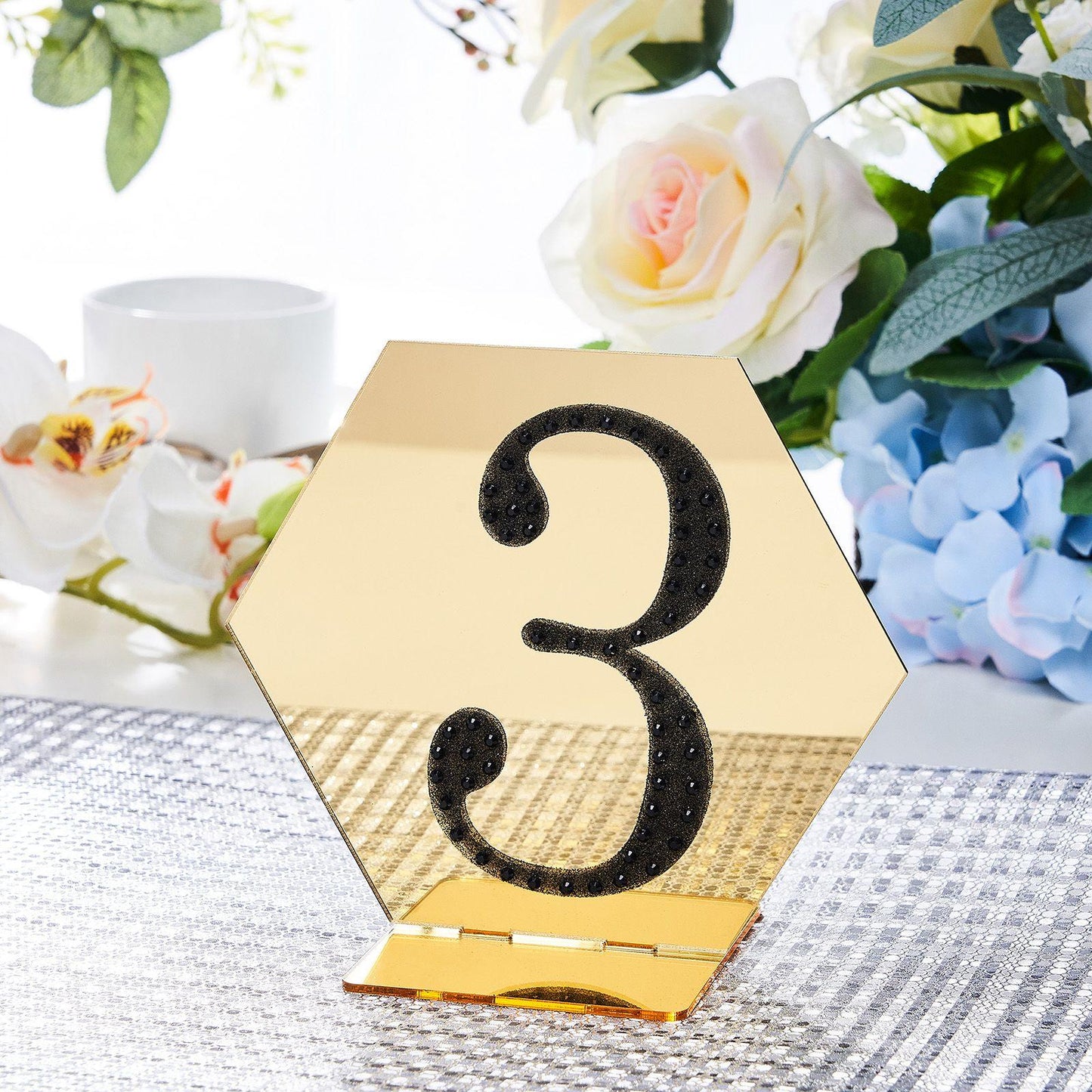 Black decorative rhinestone number sticker "3" on a hexagon mirror display.