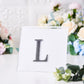 Black rhinestone letter "L" sticker for DIY crafts.