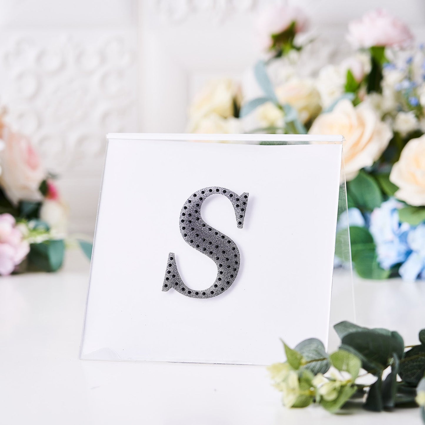 Black rhinestone letter "S" sticker for DIY crafts.