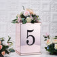 Black decorative rhinestone number 5 sticker on a floral display.