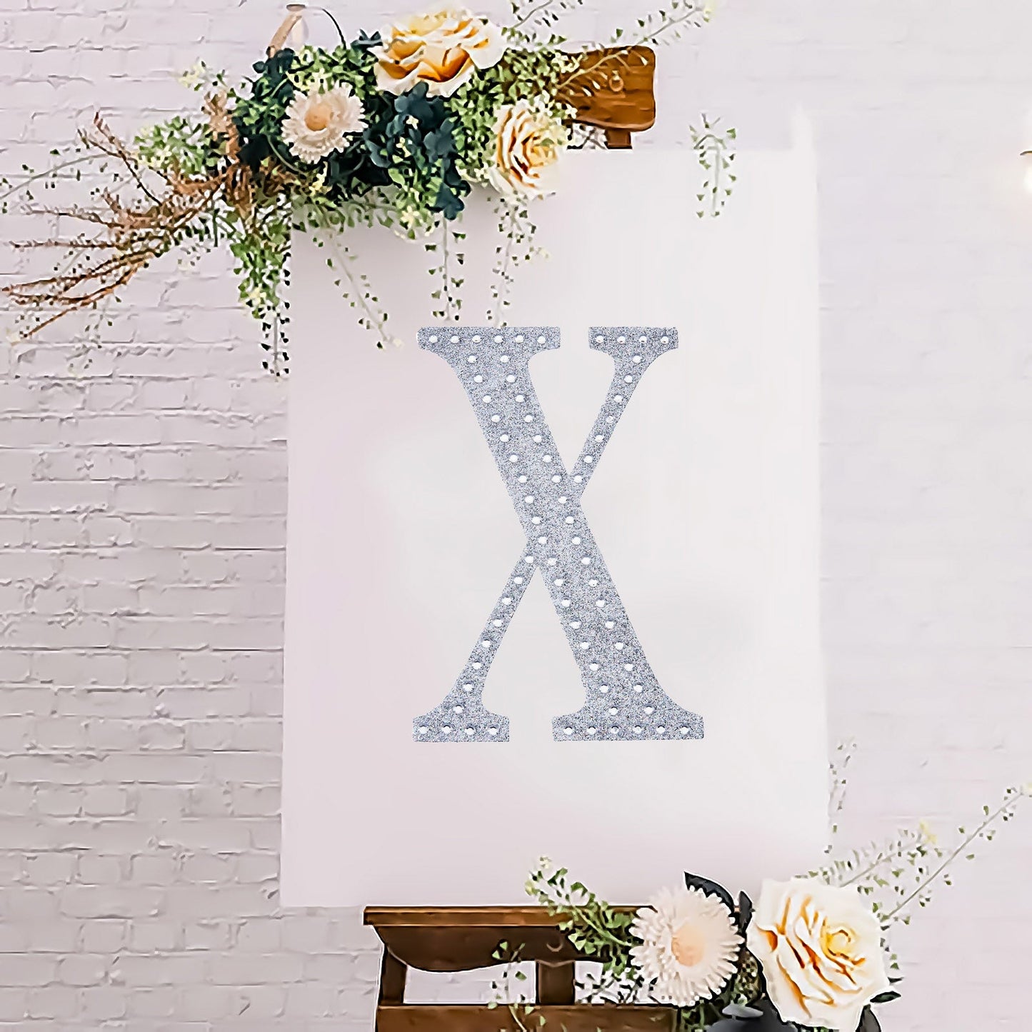 Silver decorative rhinestone letter "X" for DIY crafts.