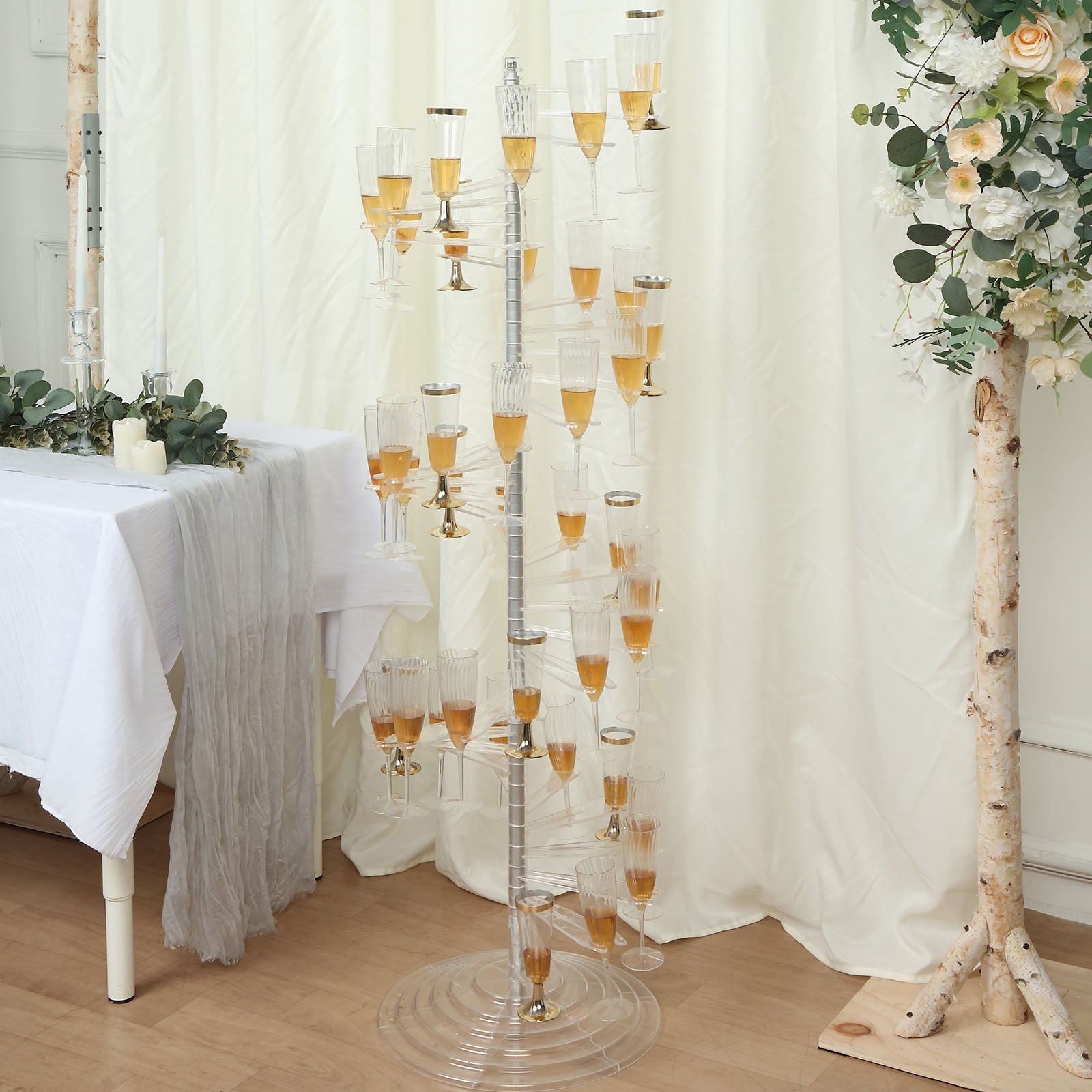 Clear acrylic spiral cocktail tree stand with 40 holders for champagne flutes.