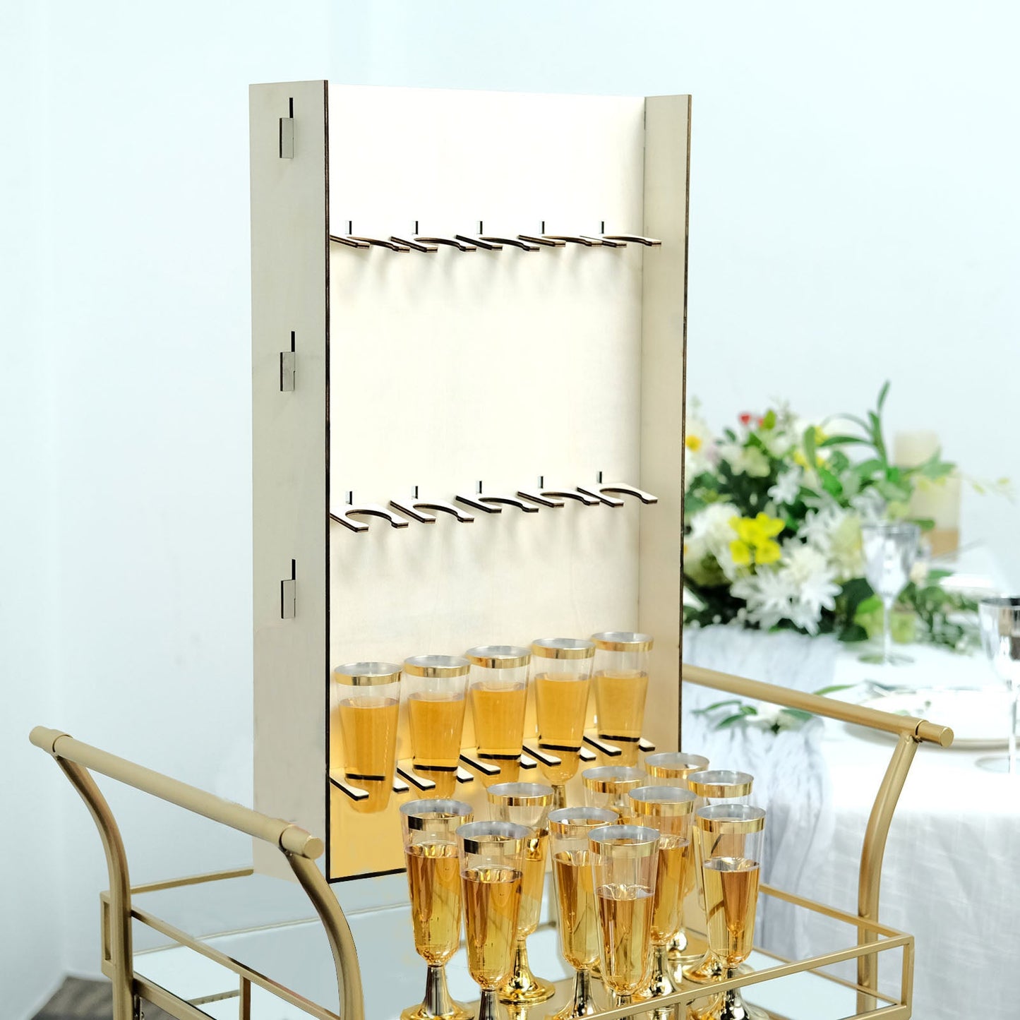 3-Tier wooden champagne flute holder rack with gold glasses.