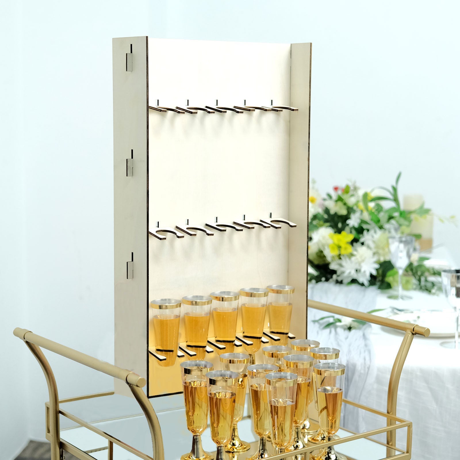 3-Tier wooden champagne flute holder rack with gold glasses.
