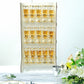 Wooden champagne flute holder rack displaying 15 glasses with golden accents.