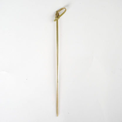 Eco-friendly twisted knot bamboo cocktail stick, 6 inches long.