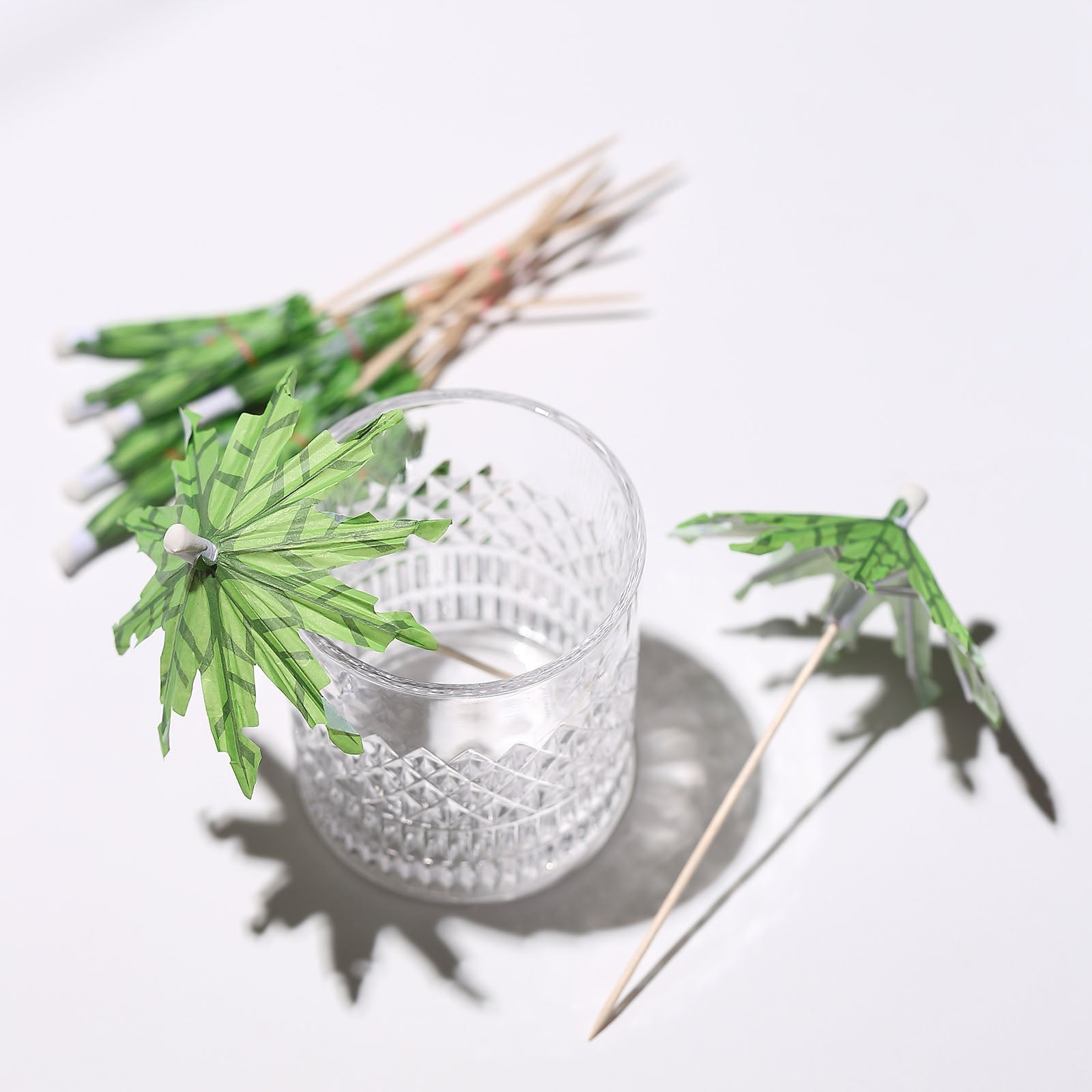6" Green Tropical Leaf Cocktail Umbrella Picks on bamboo skewer sticks.