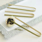 Eco-friendly natural bamboo wooden tongs on a serving platter.