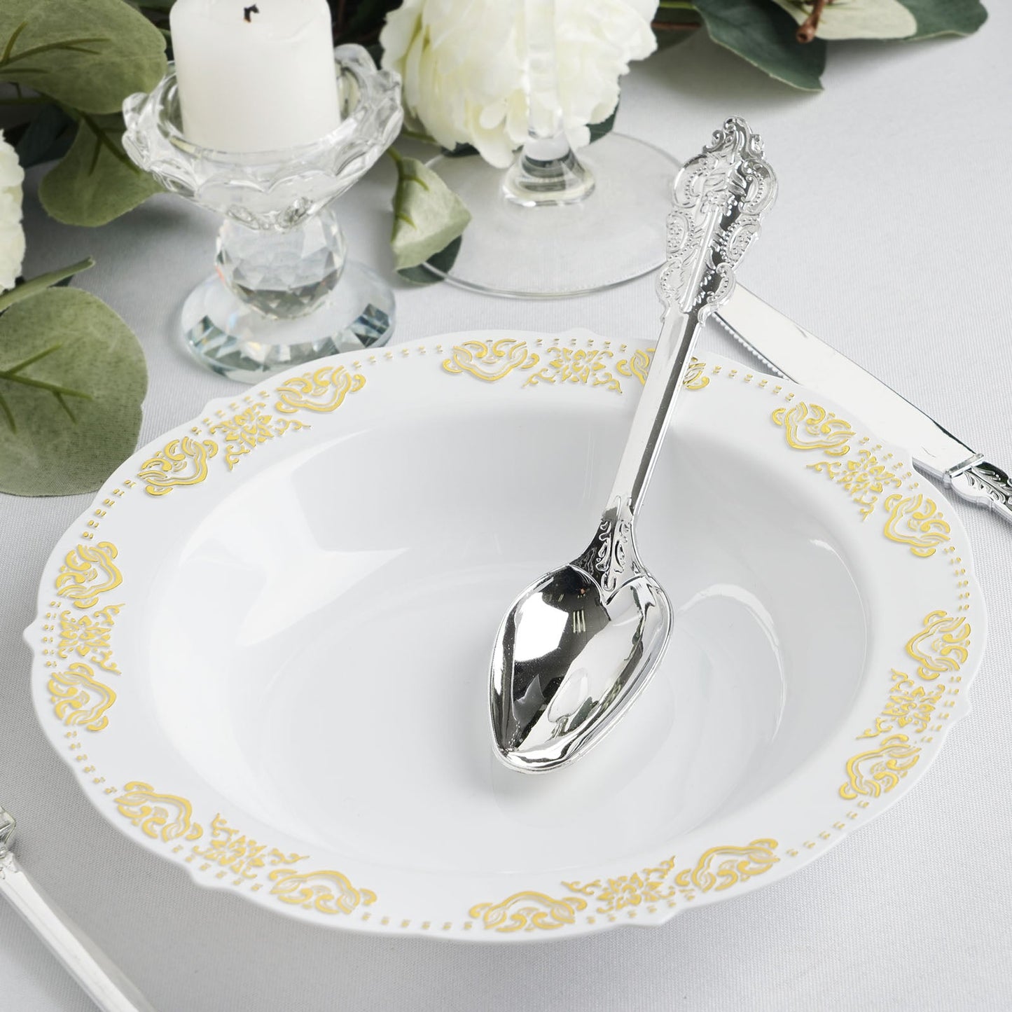 Gold embossed white disposable soup bowl with scalloped edges.